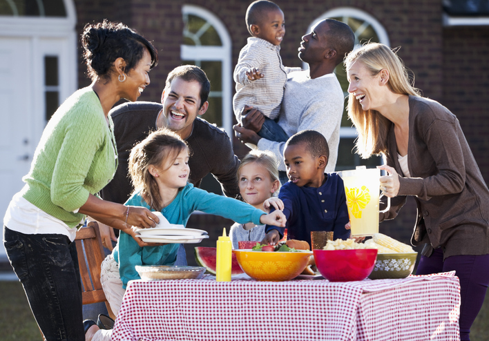 family having a picnic around a table