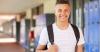 Smiling male student with backpack