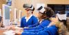 young students using virtual reality headsets